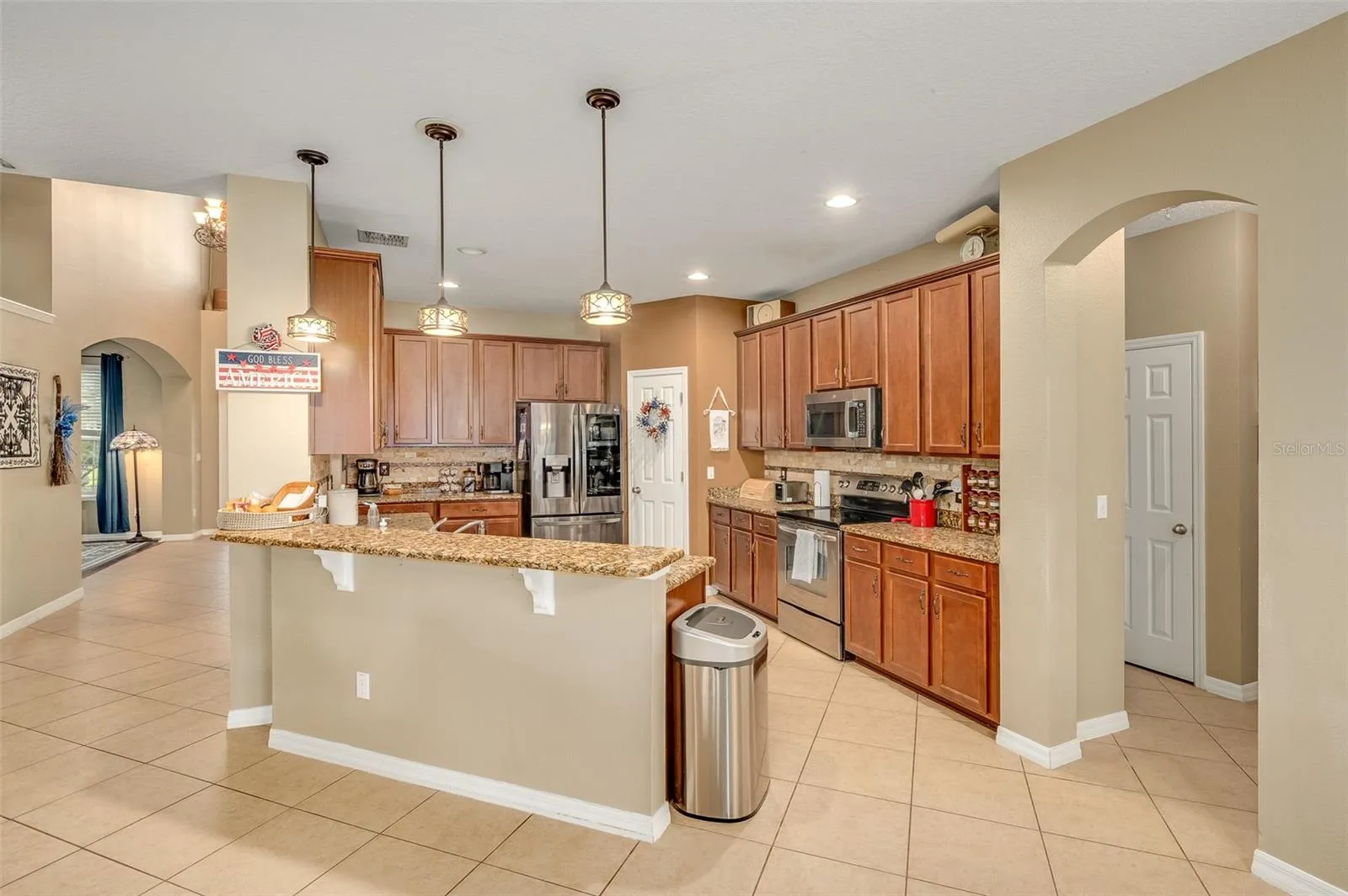 Breakfast bar, dining nook in front of bar; garage &amp; laundry, full bathroom and extra bedroom off the side of the kitchen