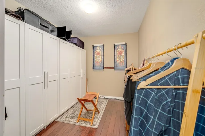 Primary bedroom walk-in closet