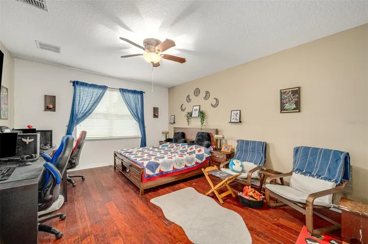 Downstairs Primary bedroom w/ ensuite bathroom and walk-in closet
