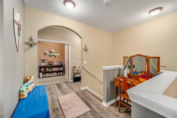 Stairway up to loft, movie room and additional bedrooms/bathrooms