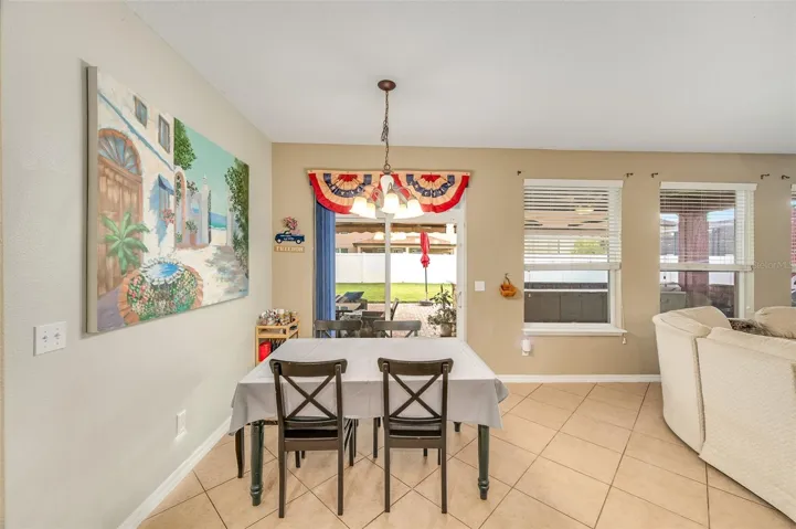 Breakfast/dining nook in front of kitchen and open layout with family room