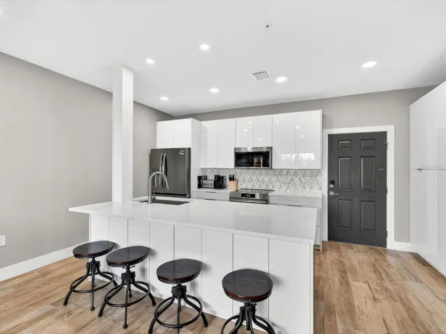 Completely renovated by General Contractor, custom kitchen w/modern gloss cabinetry and quartz counters