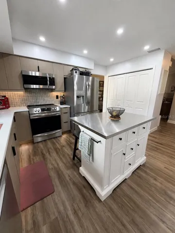 The island gives you more storage and area for meal prep. Large pantry and plenty of cabinet space!