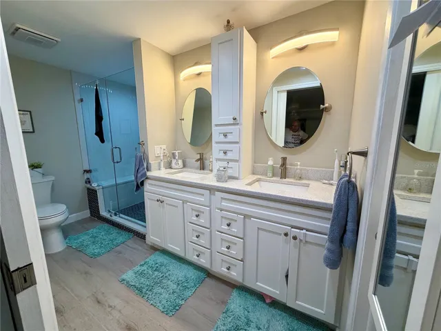 Master bath with all the custom upgrades! Walk-in shower with bench, dual vanities and sinks and a huge walk-in master closet!