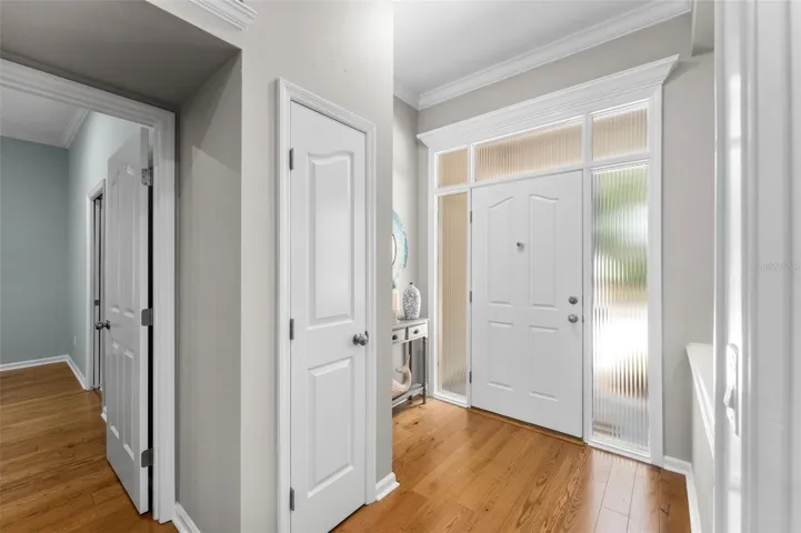 Foyer with Primary Suite doorway on the left