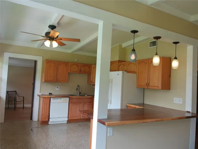 Open kitchen with bar seating.