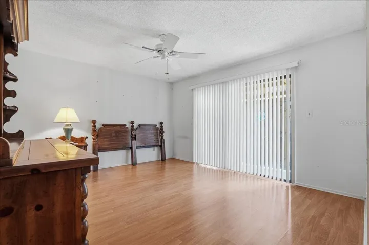 Primary Bedroom with Sliding Doors to Back Yard