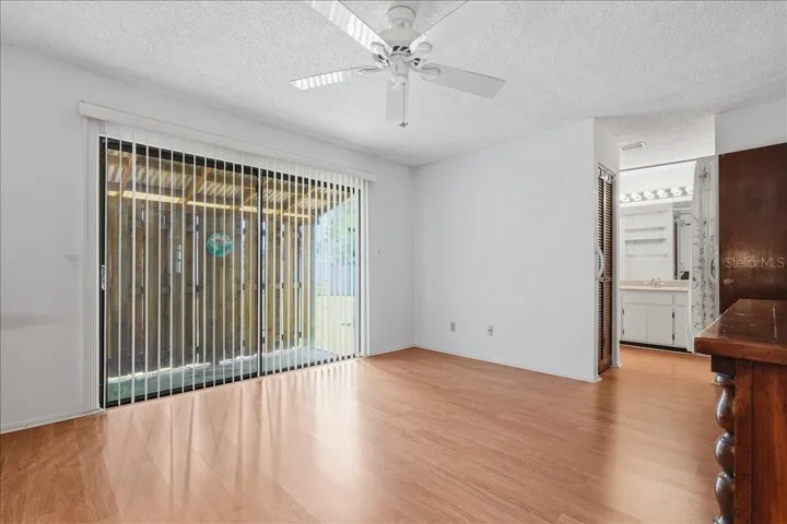 Primary Bedroom with Sliding Doors to Backyard