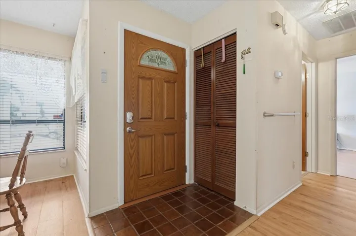 Tiled Foyer and coat closet