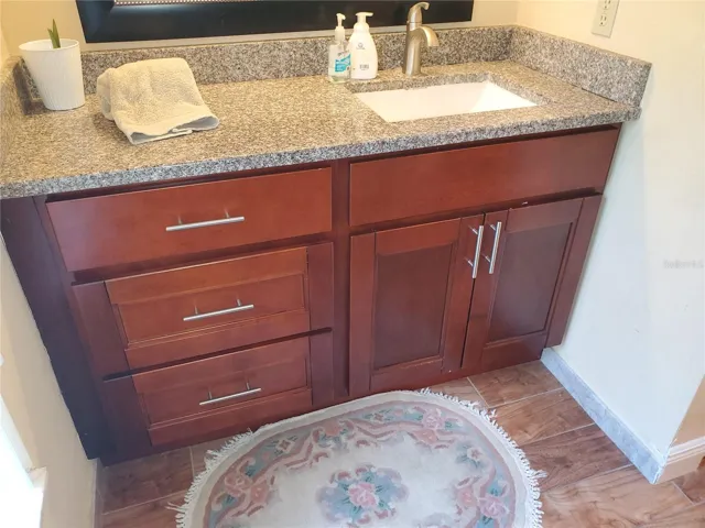 Granite with wood cabintry