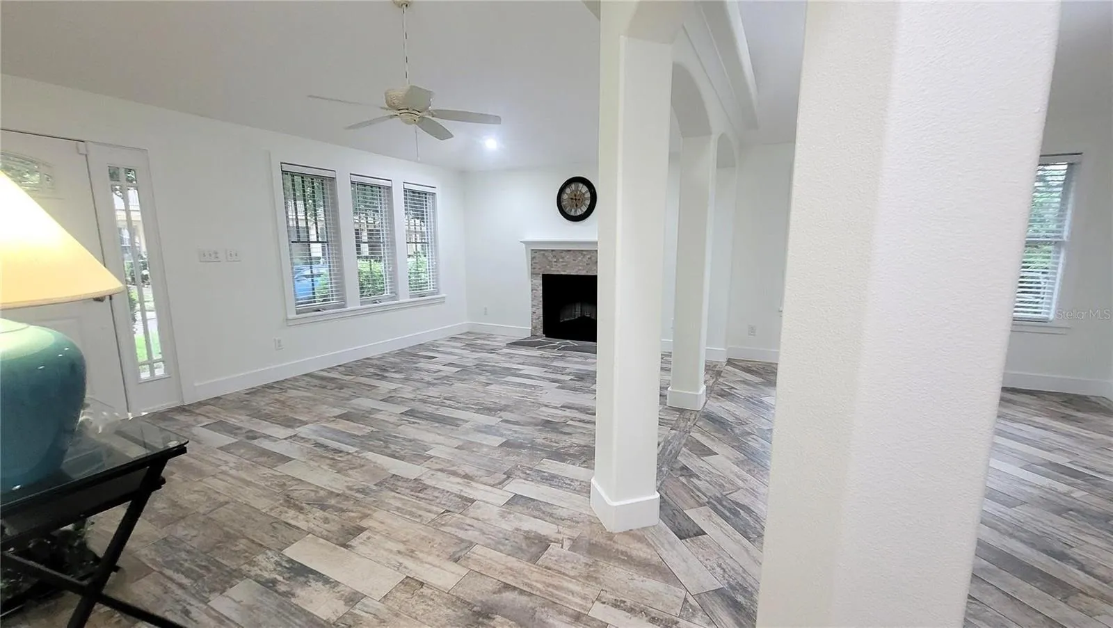 Spacious Living Room and dramatic Dining Room with defining columns.