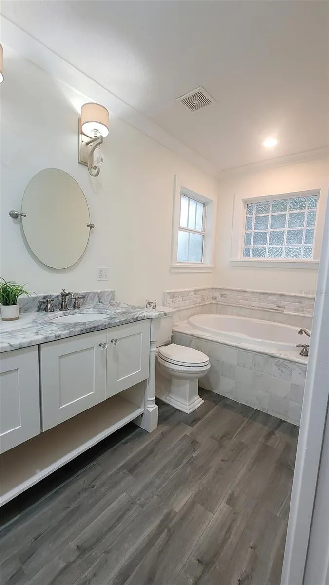Beautiful garden tub to soak in and relax away the days' worries.