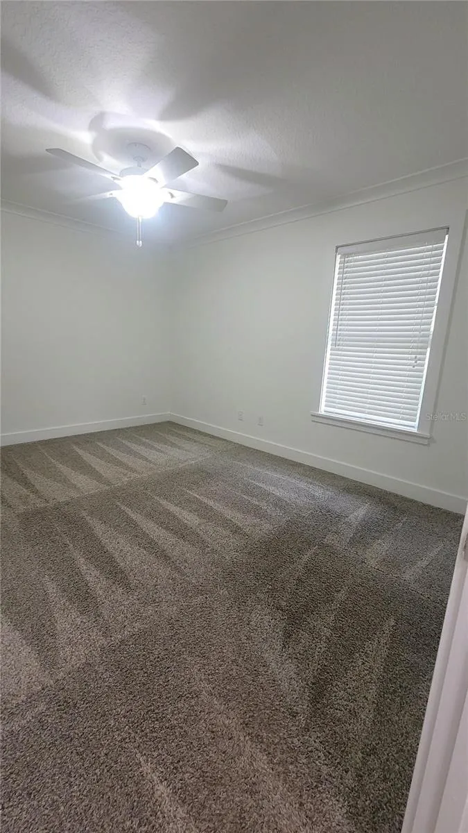 Bedroom Two, with ample room for a queen bed.