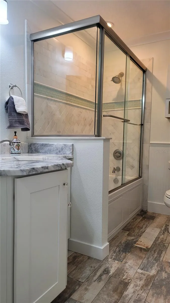 Hall Bath, with pretty tub and shower, quartzite counters