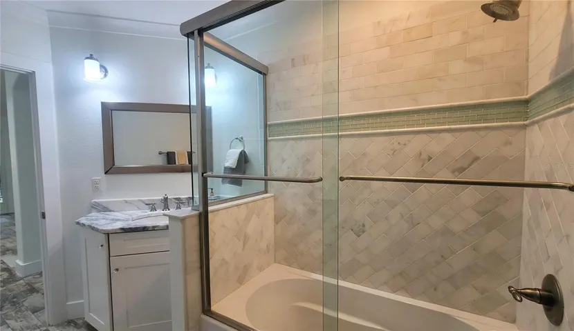 Hall Bath, with pretty tub and shower, quartzite counters