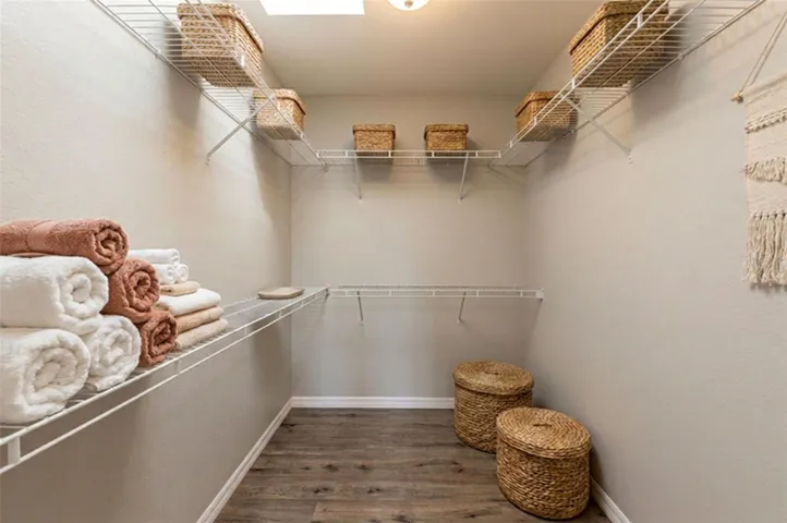 Virtually Staged primary walk in closet
