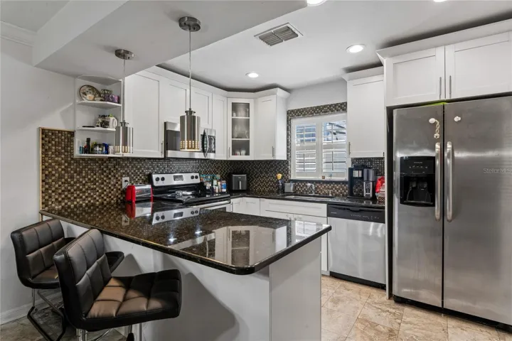 Updated Kitchen Stainless Steel appliances, Granite, Pendant lights, Breakfast Bar
