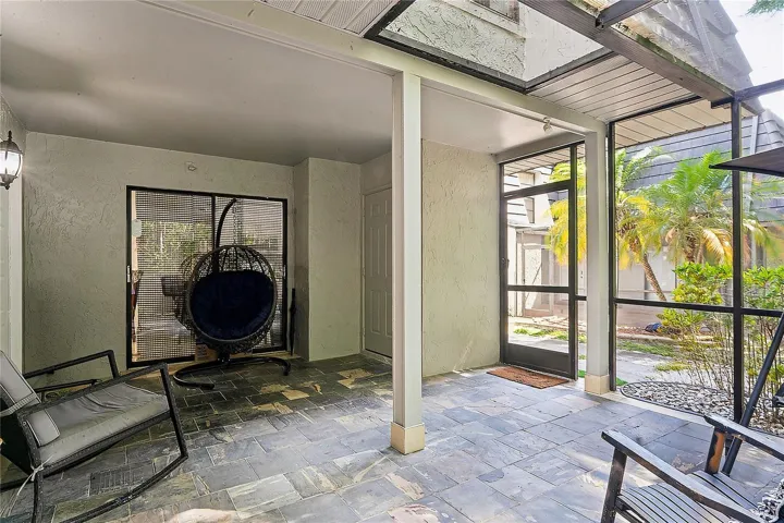Large Front Screened and partially covered patio with Storage Closet