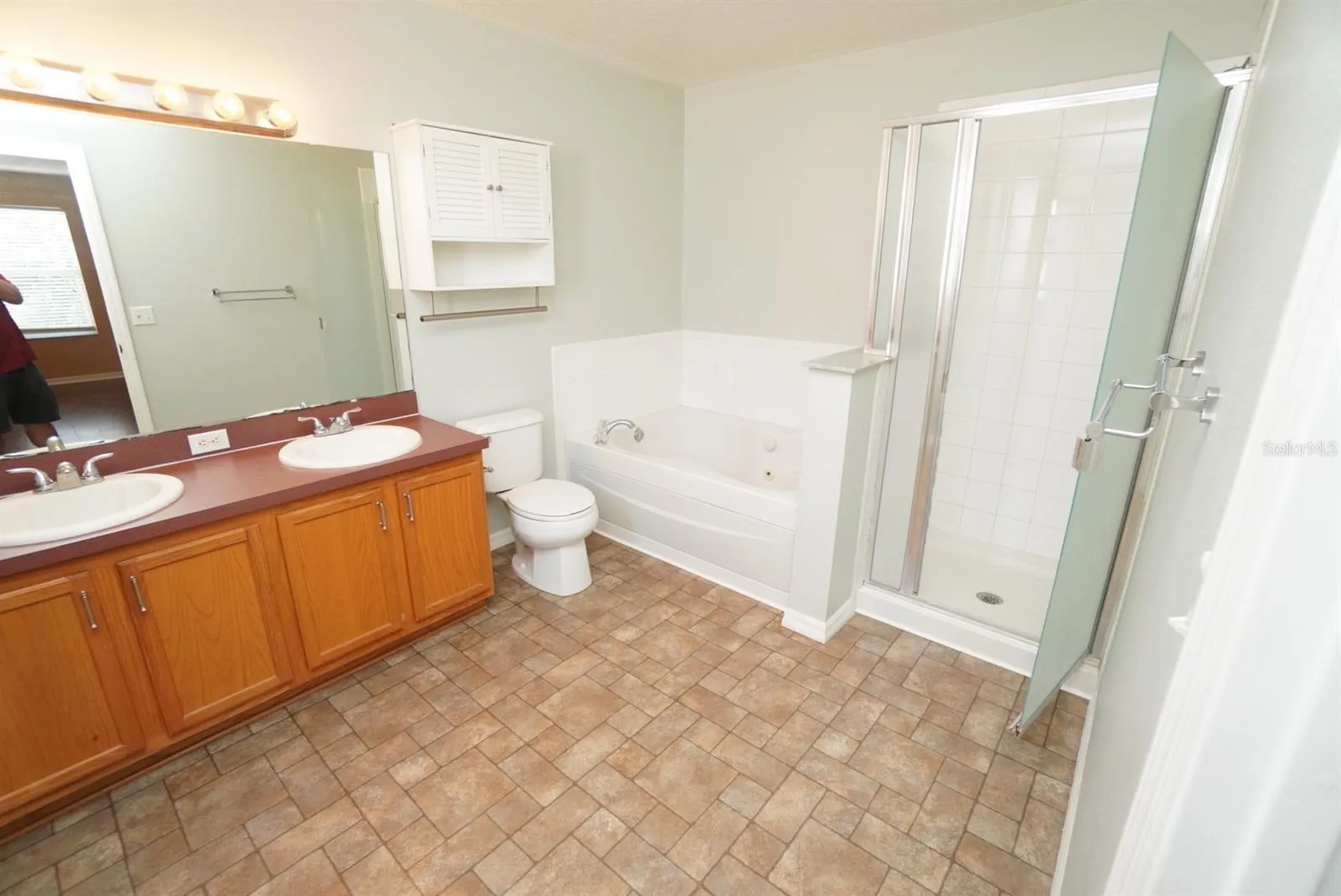 Master Bath has garden and stand up shower  tub