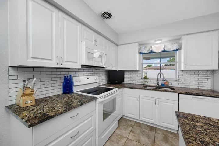 Granite Countertops and Subway Tile