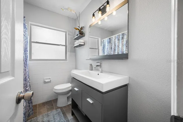 Modern and Updated Vanity - New Light - Pretty Tiled Floors