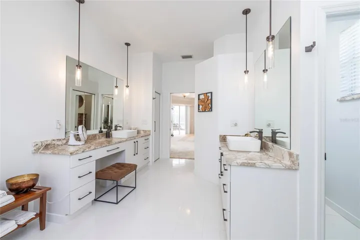 His and Hers sinks with stone counters and updated lighting