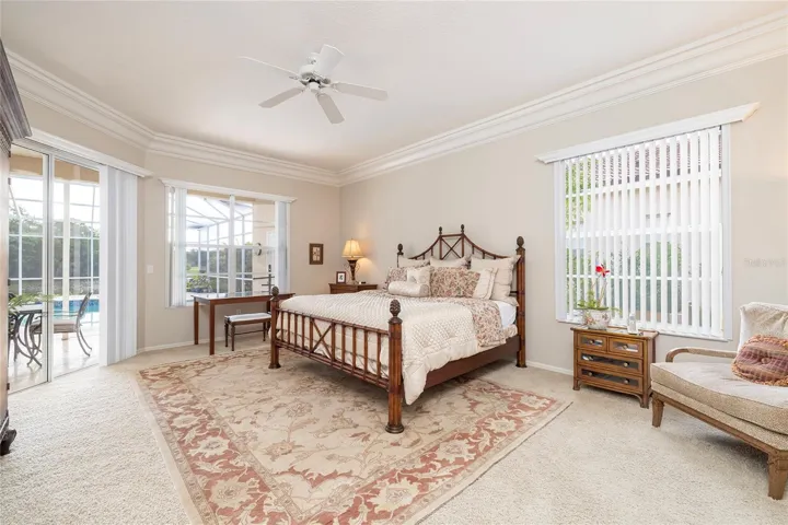 Primary bedroom with pond view and pool/spa access