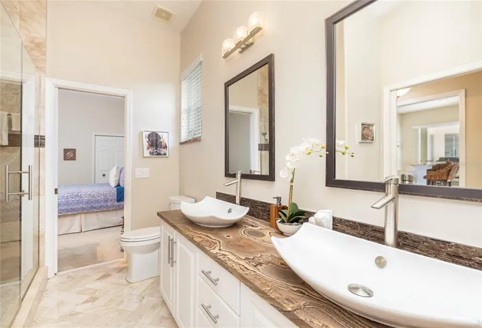 Second full bath with double sinks and upgraded Quartzite counter