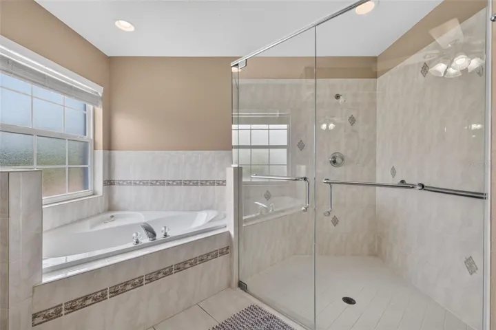 Frosted glass lends privacy in the primary bathroom.