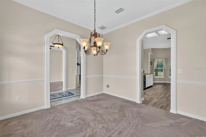 Dining room w/ views of the kitchen.