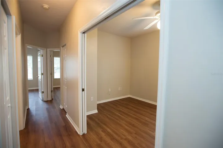 Hallway to secondary bedrooms and den