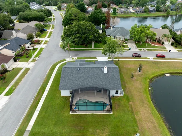 Aerial view showing the spacious corner lot & layout.