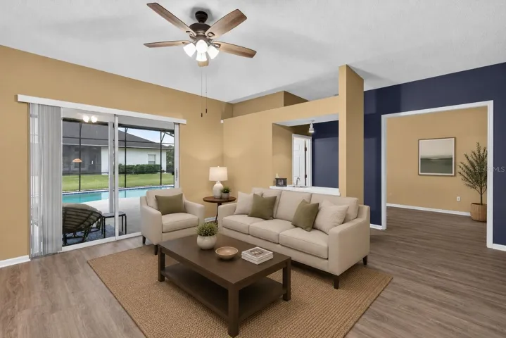 Family room w/ sliders to the pool area.