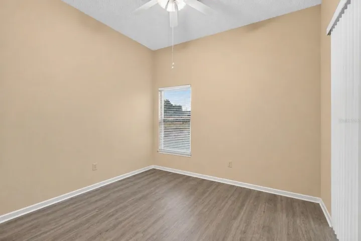 Guest bedroom with sliders to the pool.