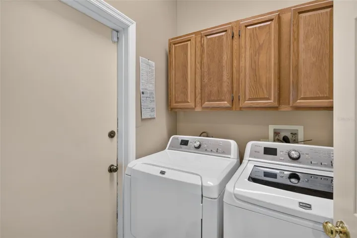 Laundry room and door to the garage. Washer and dryer are included.