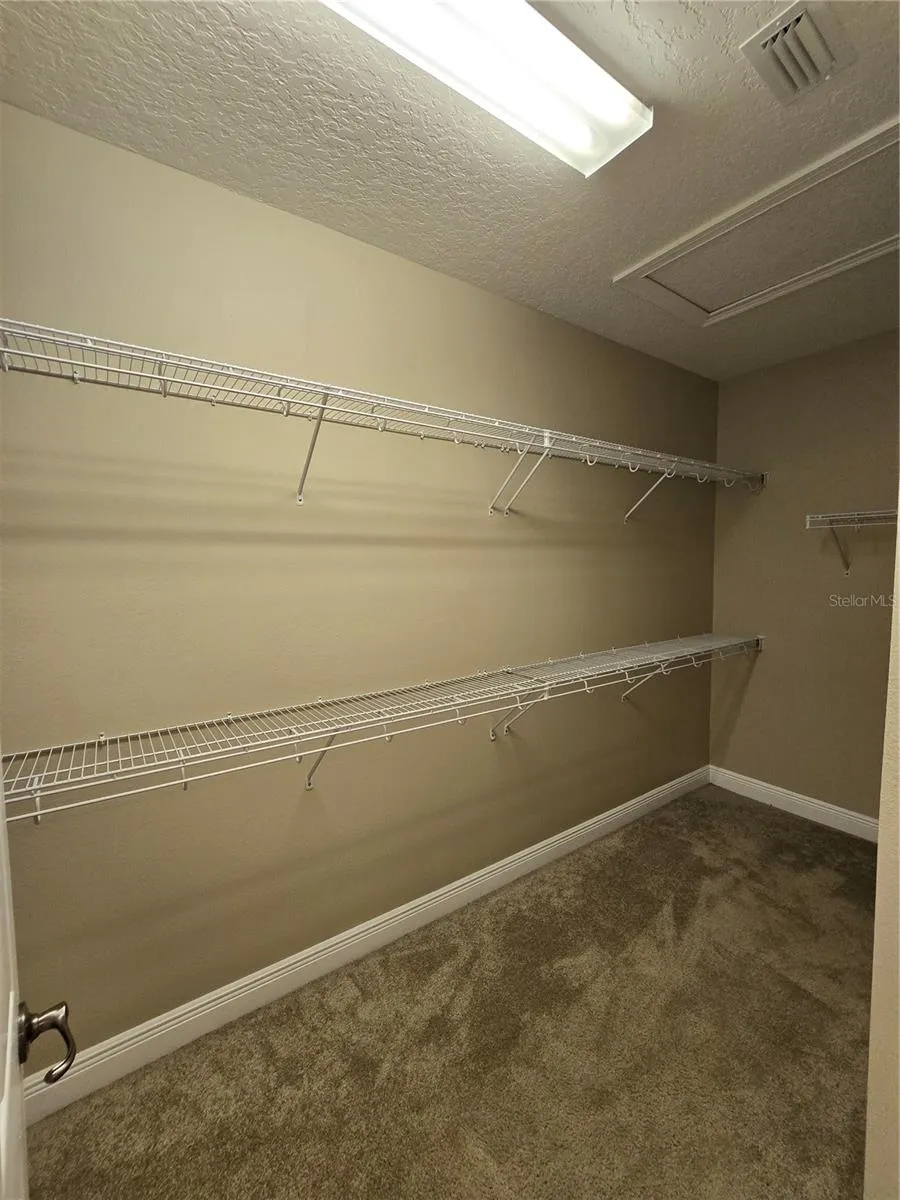 Walk in closet #1 in Primary Bedroom