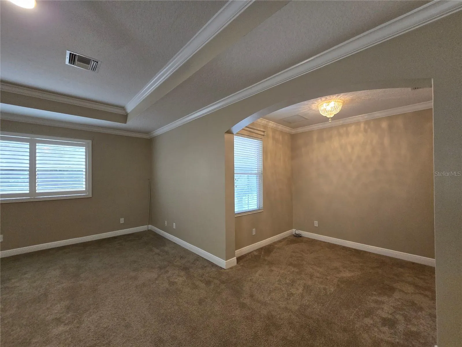 Double door entry to primary suite (24 x 16), tray ceiling, plantation shutters, flex space and ensuite bath.