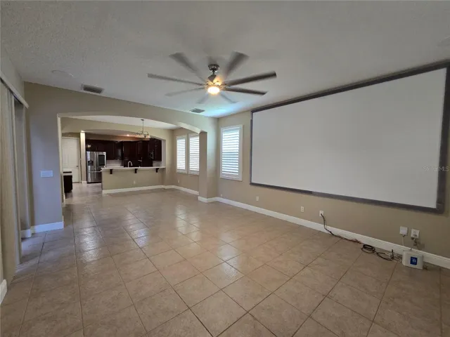 View from great room towards dining/breakfast space and kitchen. Architectural features and plantation shutters.