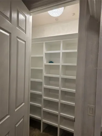 Bedroom 2 converted to a large built out walk in dressing room.