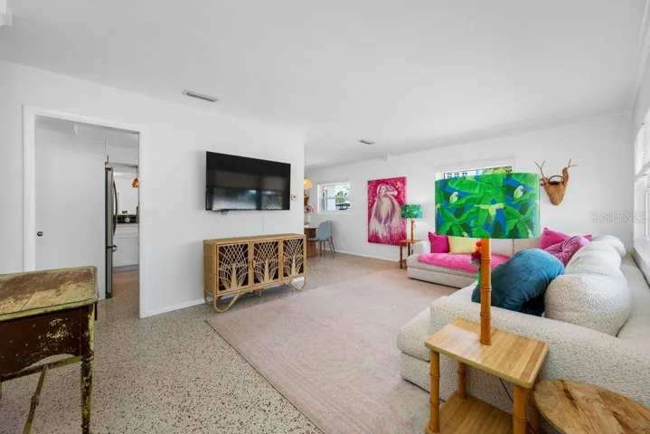 View from Front Door Entrance into the Living Room - Kitchen Entrance is to the Left and Dining Room is to the Right