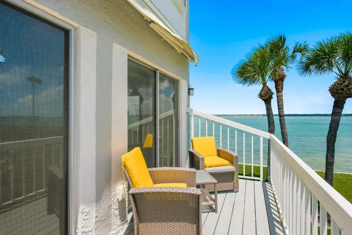 sliders to balcony overlooking pool and intracoastal