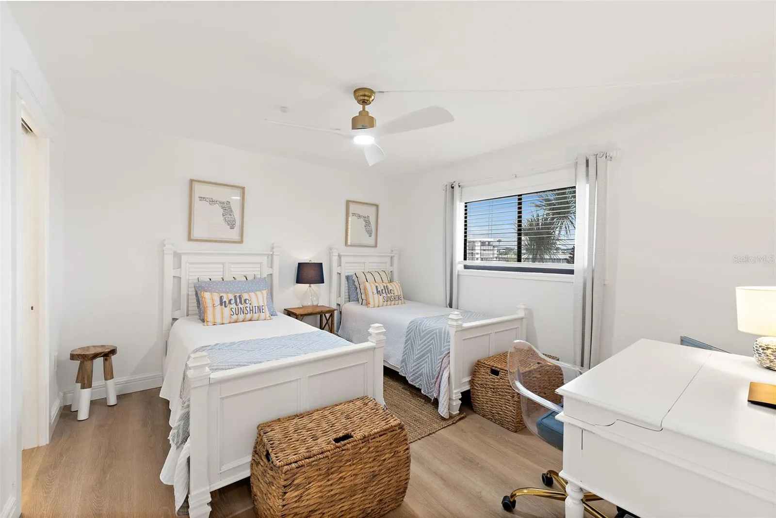 Guest bedroom with twin beds, ceiling fan, and window view of palm trees, Cocoa Beach condo
