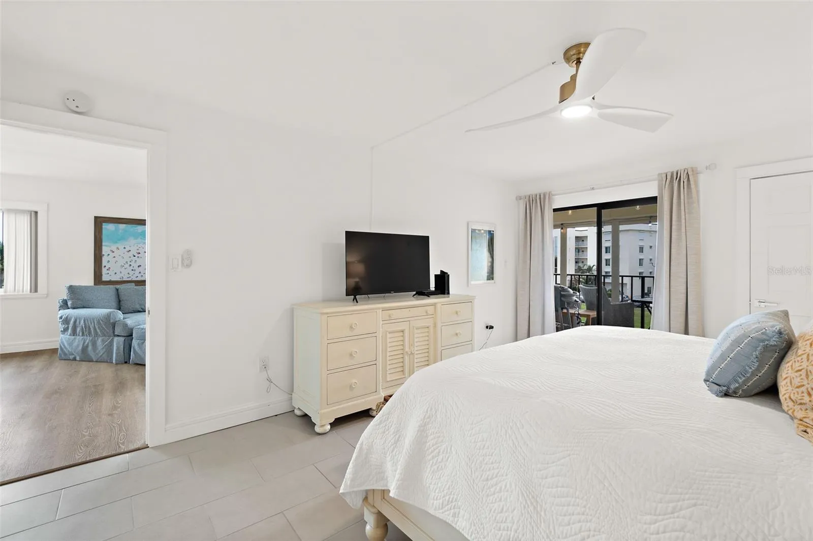 Primary bedroom with balcony access, Riverwest condo
