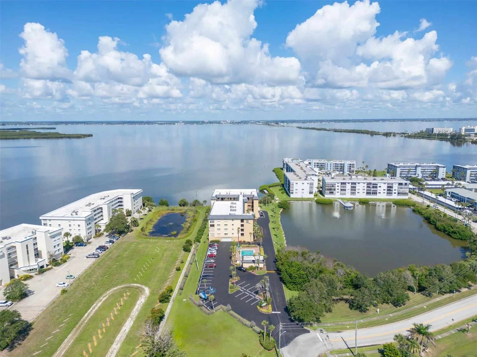 Aerial view highlighting the unit floor at Riverwest condo with pond and river views, Cocoa Beach, Florida