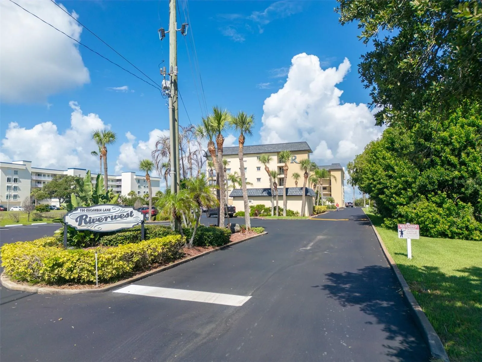 Riverwest condominium entrance sign at 190 Escambia Lane, Cocoa Beach, Florida