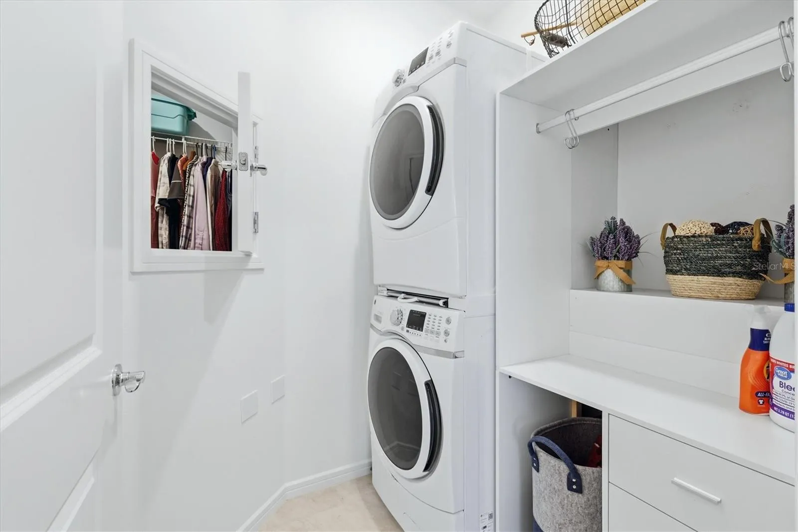 Laundry room has a pass thru from the primary and extra storage