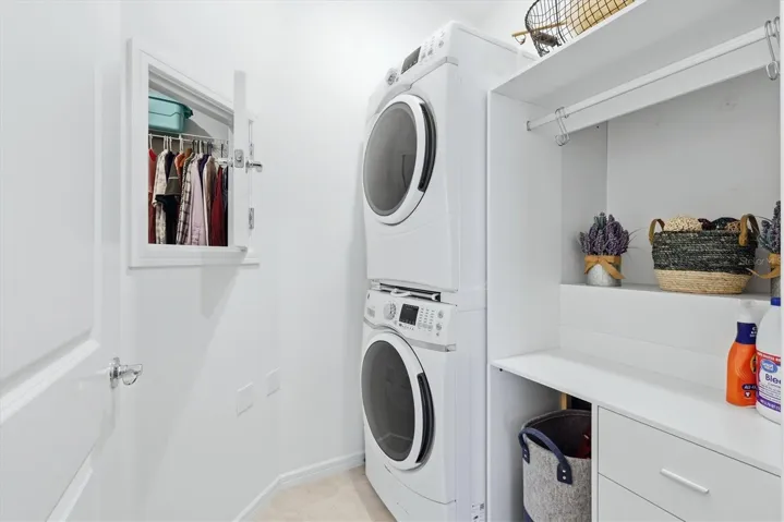 Laundry room has a pass thru from the primary and extra storage