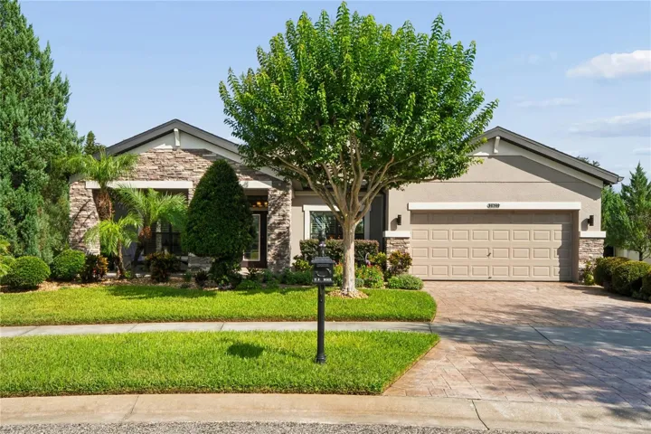 Florida Landscaping in the Front of the Home Gives Maximum Curb Appeal to 21627 Pearl Crescent Ct.