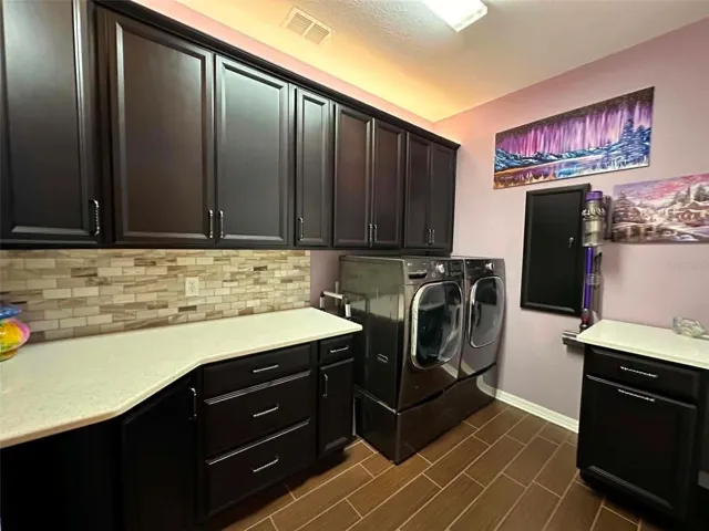 Beautiful Well Thought Out Laundry Space with Maximum Storage and Counter Space
