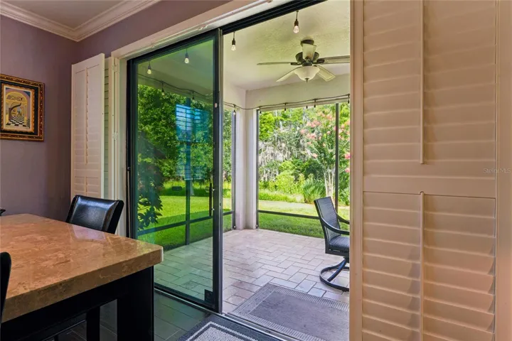 Bring the Outside in, with the Open Feel of a Slider from the Kitchen/Living Space. Plantation Shutters allow you to adjust the lighting and privacy any time of day or night.